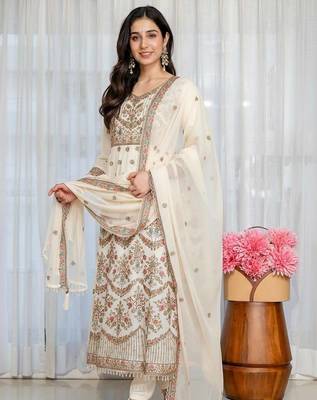 Designer white faux blooming anarkali gown with heavy zari embroidery & moti lace 1