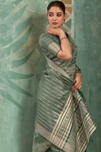 Sage green cotton tissue zari woven saree with broad patta & running blouse