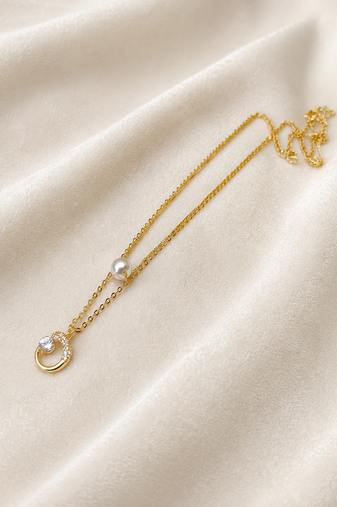 Gold-tone pearl and crystal moon pendant necklace