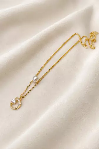 Gold-tone pearl and crystal moon pendant necklace