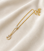 Gold-tone pearl and crystal moon pendant necklace