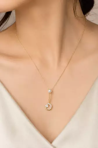 Gold-tone pearl and crystal moon pendant necklace