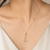 Gold-tone pearl and crystal moon pendant necklace