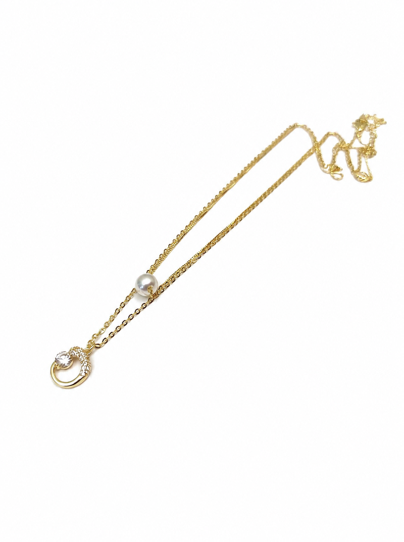 Gold-tone pearl and crystal moon pendant necklace