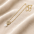 Pearl drop pendant necklace with floral cz, gold-tone chain