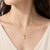 Pearl drop pendant necklace with floral cz, gold-tone chain