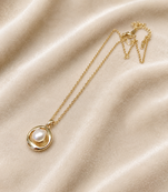 Gold-tone pearl pendant necklace with round swirl setting