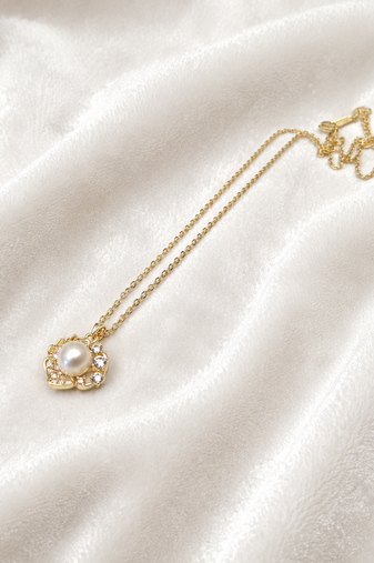 Pearl flower pendant necklace with crystal accents, gold tone