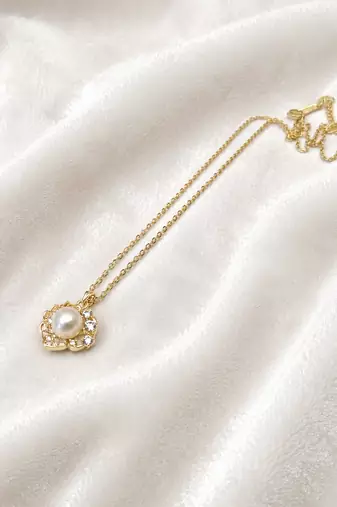 Pearl flower pendant necklace with crystal accents, gold tone