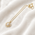 Pearl flower pendant necklace with crystal accents, gold tone