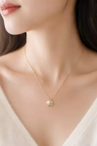 Pearl flower pendant necklace with crystal accents, gold tone