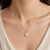 Pearl pendant necklace with crystal halo, gold-tone chain