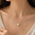 Pearl pendant necklace with gold-tone rope frame chain
