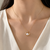 Pearl pendant necklace with gold-tone heart frame and crystal