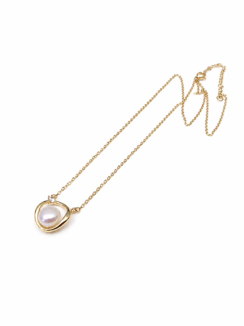 Pearl pendant necklace with gold-tone heart frame and crystal