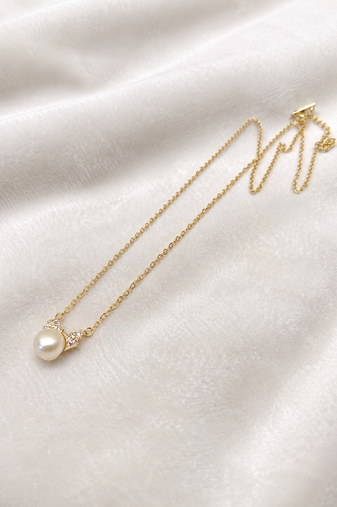 Pearl pendant necklace with crystal accents, gold chain