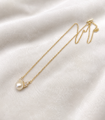 Pearl pendant necklace with crystal accents, gold chain