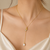 Gold-plated lariat necklace with freshwater pearl pendant
