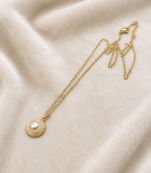 Pearl pendant necklace with gold-tone milgrain bezel setting