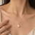 Pearl pendant necklace with gold-tone milgrain bezel setting