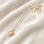 Pearl flower pendant necklace with gold-tone chain