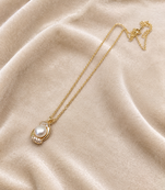 Pearl pendant necklace with crystal accents, gold-tone chain