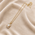 Pearl pendant necklace with crystal accents, gold-tone chain