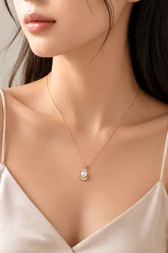 Pearl pendant necklace with crystal accents, gold-tone chain
