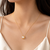 Pearl pendant necklace with gold-tone square frame