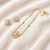 Pearl & cz baguette sunflower necklace and earrings jewellery set