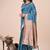 Teal blue woven linen silk blend saree with metallic striped border