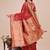 Red woven linen silk blend saree with metallic striped border
