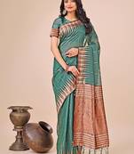 Teal green woven linen silk blend saree with metallic striped border