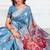 Light blue woven linen silk blend saree with floral print pallu