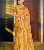 Mustard banarasi silk blend saree with rich gold zari floral weaving