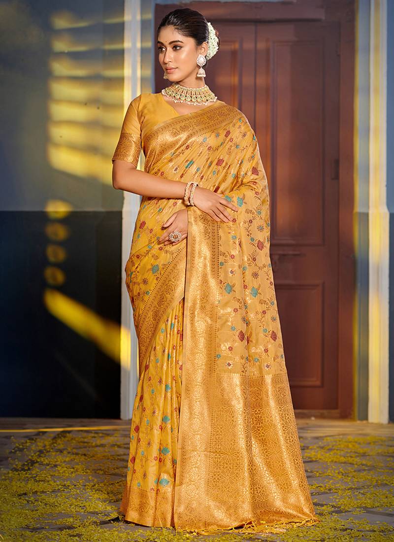 Mustard banarasi silk blend saree with rich gold zari floral weaving