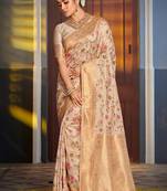 Cream banarasi silk blend saree with rich gold zari floral weaving
