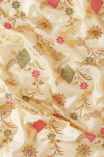 Cream banarasi silk blend saree with rich gold zari floral weaving