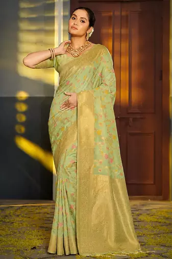 Light pistachio green banarasi silk blend saree with rich gold zari floral weaving