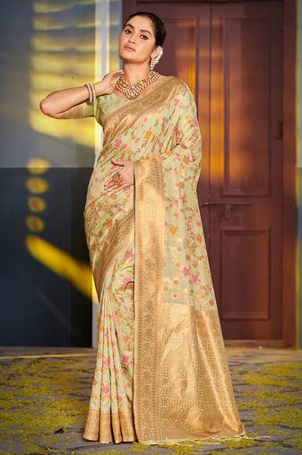 Light pistachio green banarasi silk blend saree with rich gold zari floral weaving