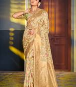 Light pistachio green banarasi silk blend saree with rich gold zari floral weaving