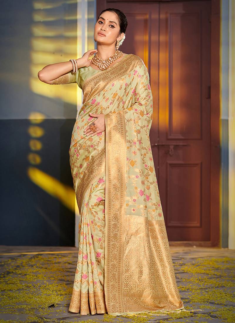 Light pistachio green banarasi silk blend saree with rich gold zari floral weaving