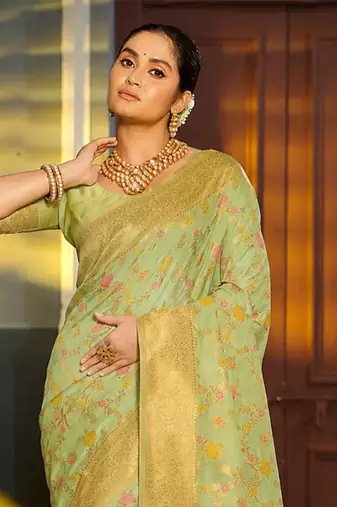 Light pistachio green banarasi silk blend saree with rich gold zari floral weaving