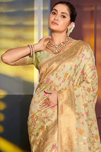 Light pistachio green banarasi silk blend saree with rich gold zari floral weaving
