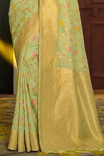 Light pistachio green banarasi silk blend saree with rich gold zari floral weaving