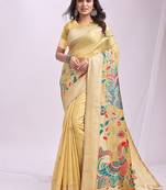 Beige handwoven linen cotton blend saree with multicolor peacock motif pallu & zari border