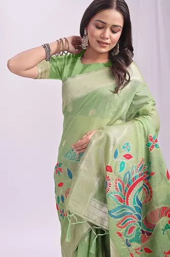 Light green handwoven linen cotton blend saree with multicolor peacock motif pallu & zari border