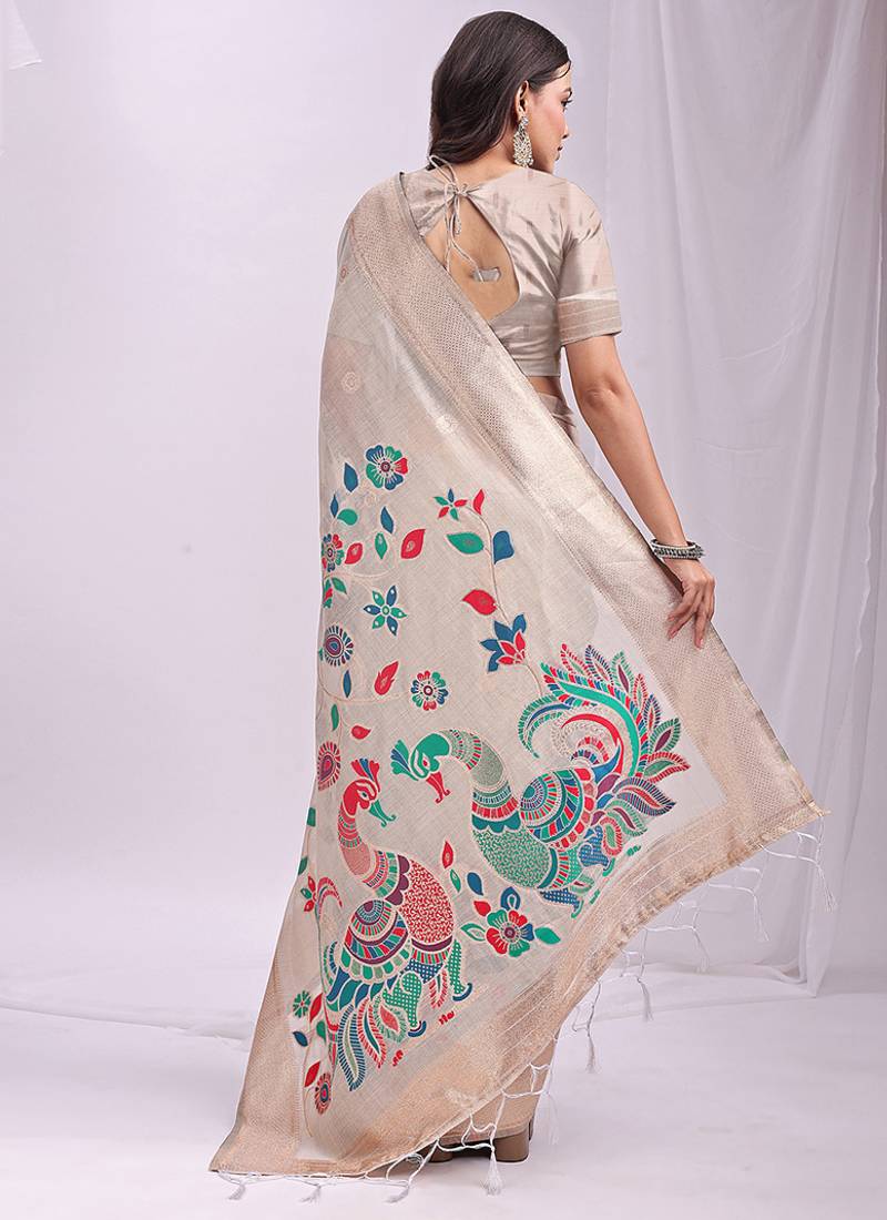 Off white handwoven linen cotton blend saree with multicolor peacock motif pallu & zari border