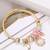 Synthetic stone studded gold plated bracelet fashion adjustable jewellery for girls & women