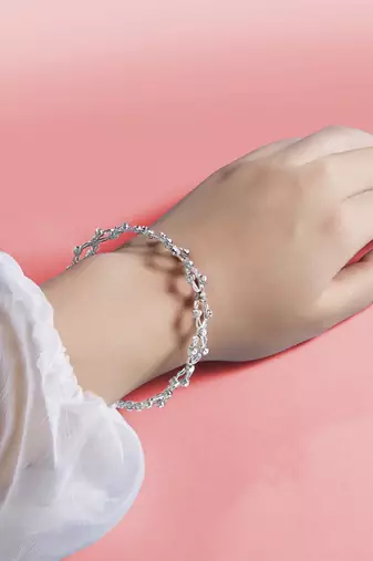 Silver plated cubic zirconia studded fancy charm bracelet cum ring jewellery for women & girls